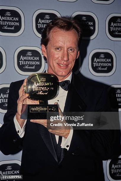 American actor James Woods, wearing a tuxedo and bow tie, in the inaugural American Television Awards press room at Santa Monica Airport's Barker...