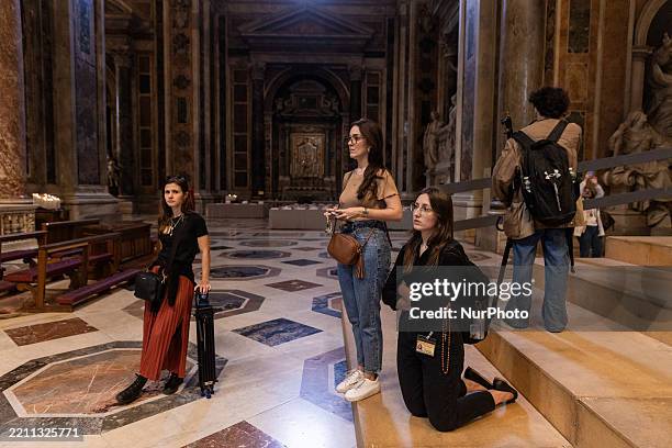 Visitors and mourners pay their respects to the body of Pope Francis one last time inside St. Peter's Basilica in Vatican City, on April 25, 2025....
