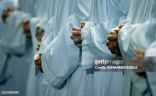 Altar servers attend the mass held by Pope Benedict XVI at the Olympic stadium in Berlin on September 22 on the first day of his first state visit to...