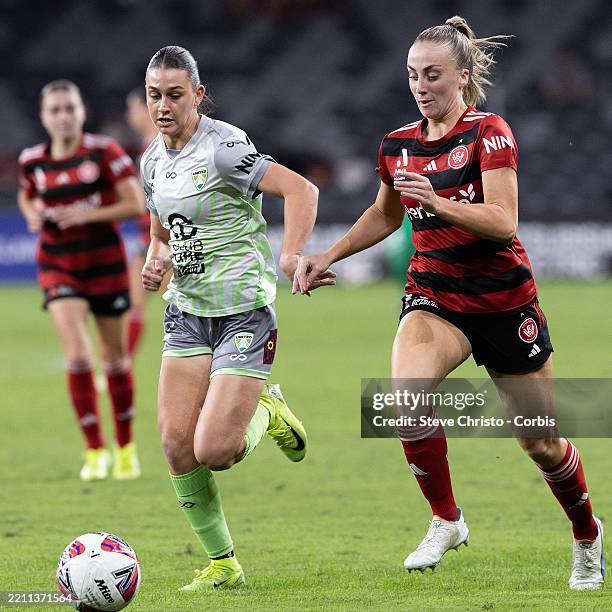 Ella Buchanan of the Wanderers dribbles the ball past Canberra's Sofia Christopherson during the round 23 A-League Women's match between Western...