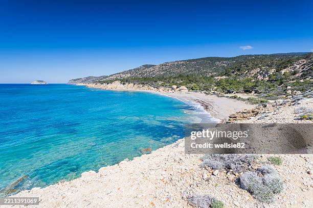 looking down on fourni beach - negative space technique stock pictures, royalty-free photos & images