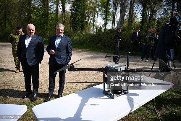 Prime Minister, Sir Keir Starmer, and Prime Minister of New Zealand, Christopher Luxon, look at drones on a display by SYOS, during a visit to a...