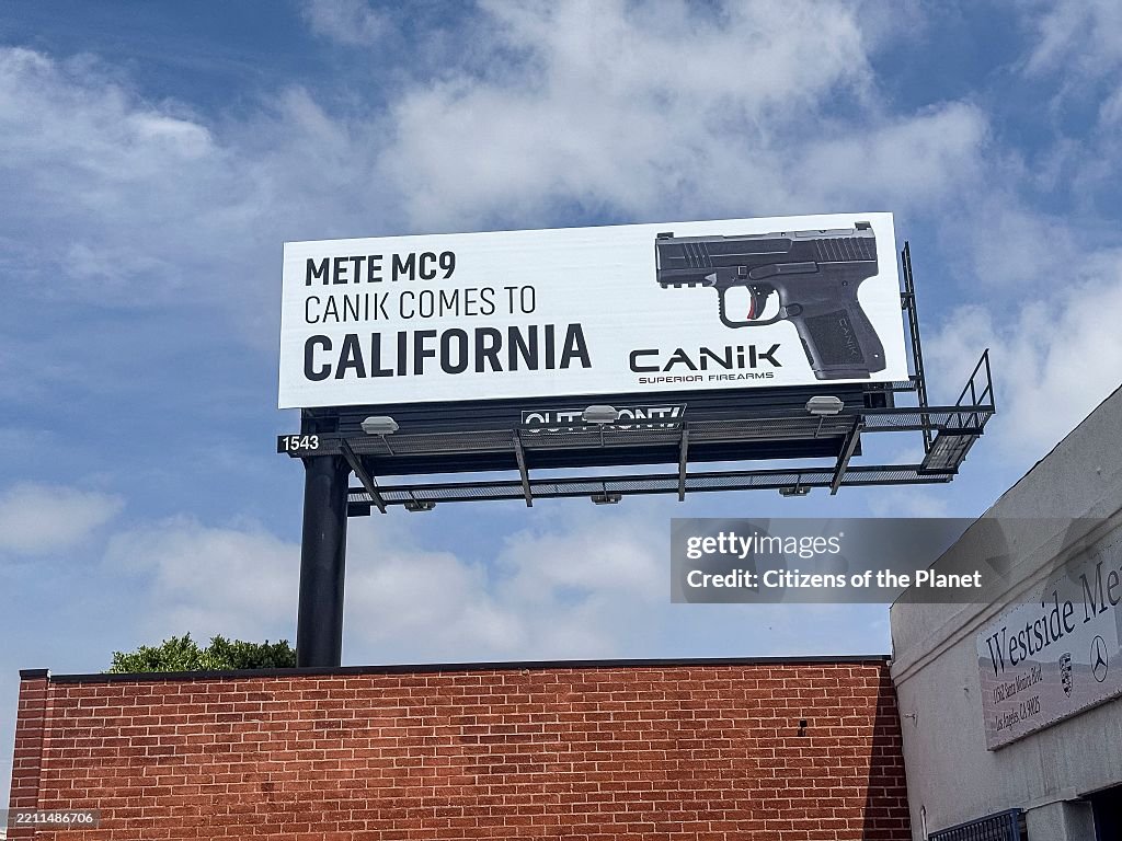 Handgun advertisement on billboard in West LA