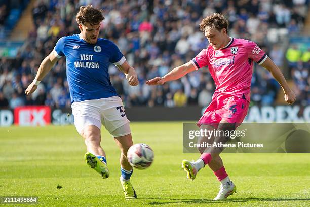 Ollie Tanner of Cardiff City attempts to block a cross from Callum Styles of West Bromwich Albion during the Sky Bet Championship match between...