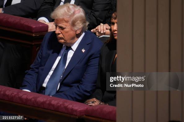 Trump Blue US President Donald Trump is seen in a blue suit during the funeral ...