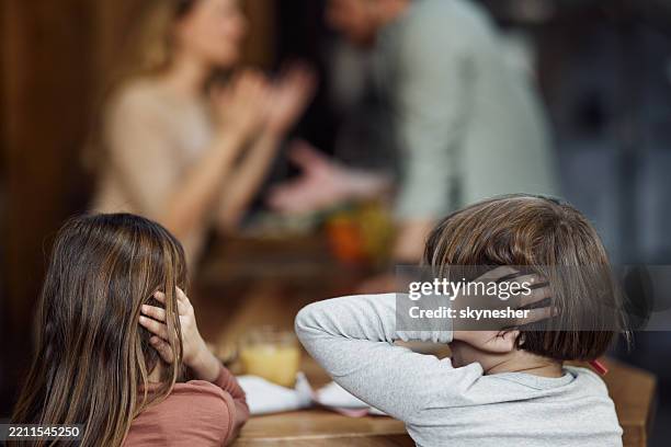 we don't want to hear our parents arguing! - sibling stock pictures, royalty-free photos & images