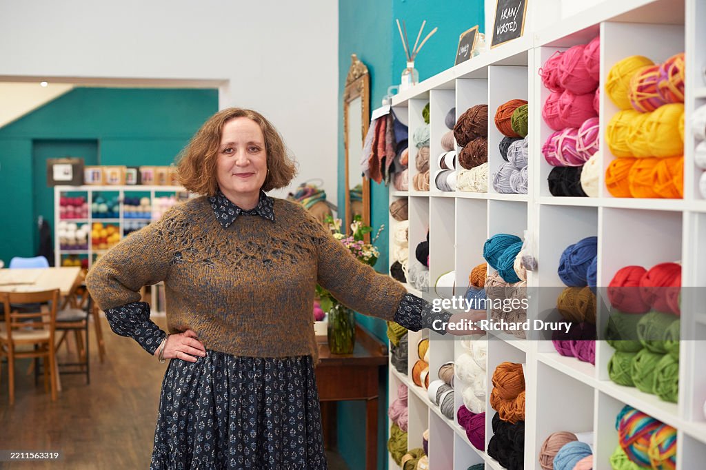 Portrait of a yarn store owner in her shop