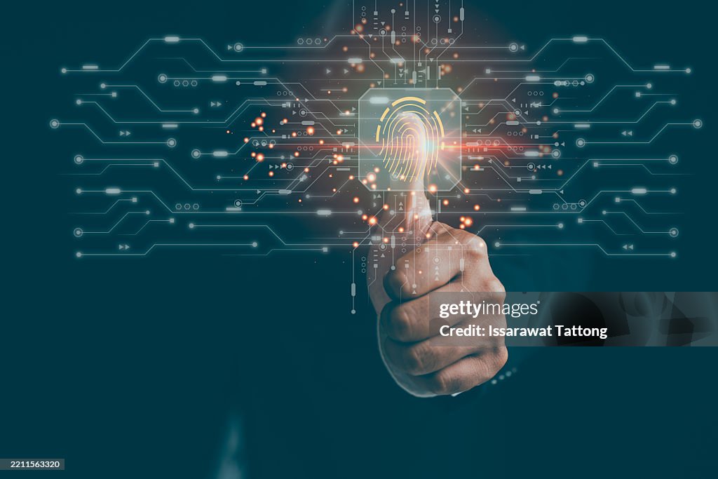 A businessman scanning his fingerprint on a digital device, highlighting fingerprint, biometric, authentication, security, and access, portraying high-tech identification.