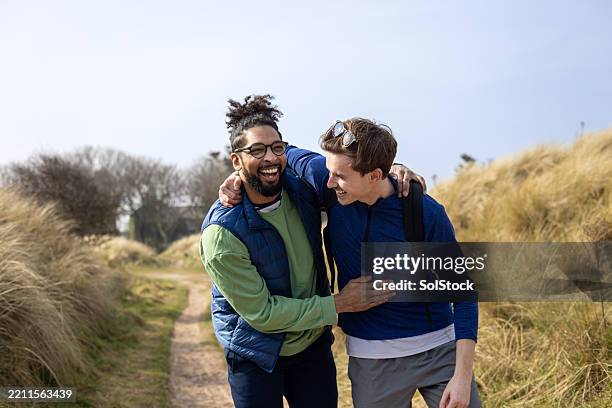 long lasting laughter - sand dune stock pictures, royalty-free photos & images