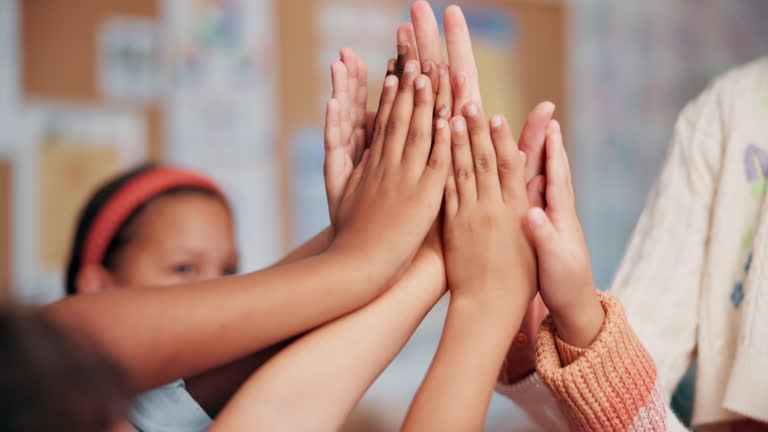 https://media.gettyimages.com/id/2211611001/video/teacher-students-and-high-five-in-classroom-hands-and-support-with-mind-development-at.jpg?b=1&s=640x640&k=20&c=sVn6qlcgiA8JDZgQFRQvnUrVAVOAYOAkP7lMS64zZPs=