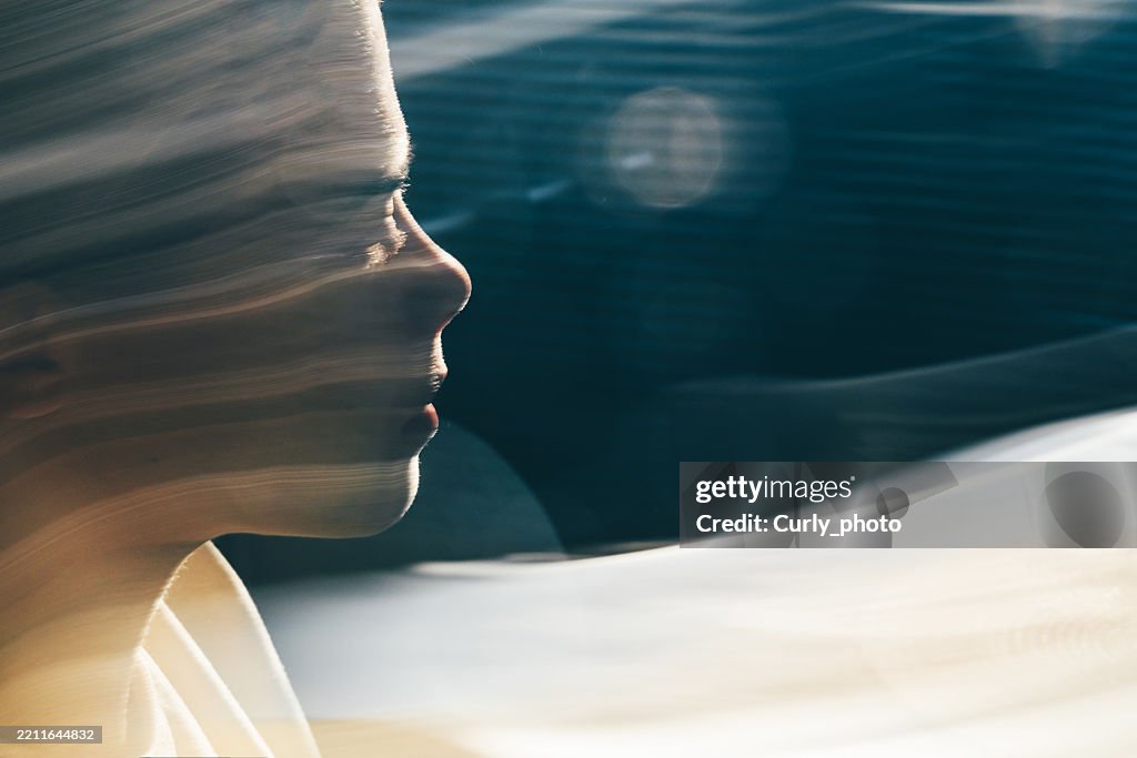 Artistic human face motion blur portrait.
