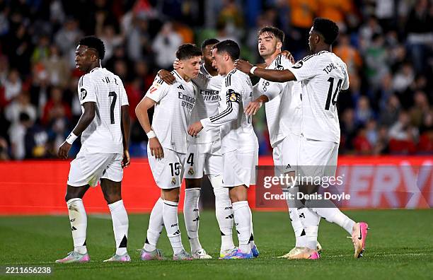 Arda Gueler of Real Madrid celebrates scoring his team's first goal with teammates during the LaLiga match between Getafe CF and Real Madrid CF at...