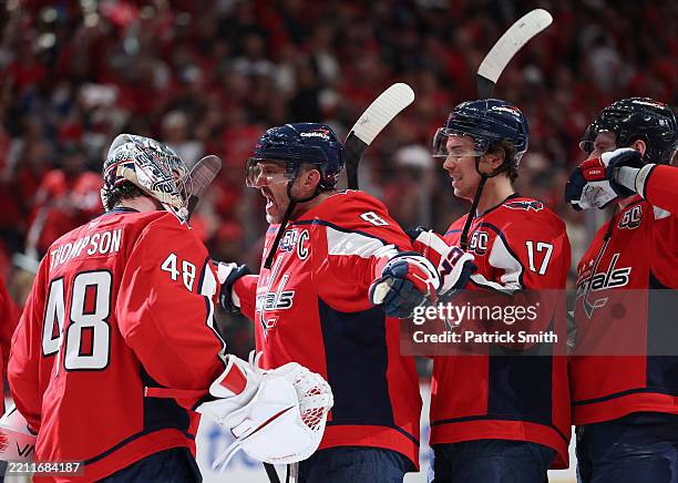 Logan Thompson and Alex Ovechkin of the Washington Capitals celebrate defeating the Montreal Canadiens in Game Two of the First Round of the 2025...