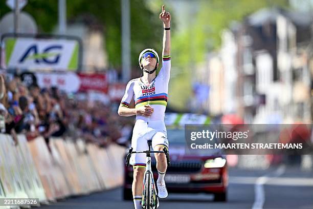 Team Emirates' Slovenian rider Tadej Pogacar celebrates as he crosses the finish line to win the Liege-Bastogne-Liege one day cycling race, 252km...
