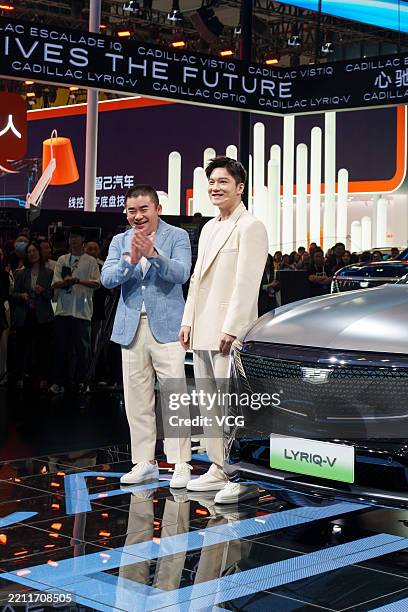 Olympic table tennis champion Fan Zhendong , also the brand ambassador for Cadillac, visits the booth of Cadillac during the 21st Shanghai...