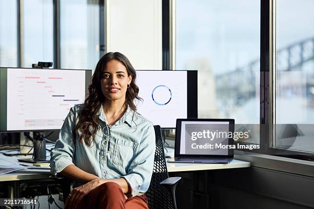 confident female business professional at office - information equipment stock pictures, royalty-free photos & images