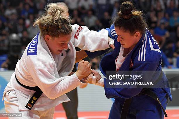 Georgia's Mariam Tchanturia and Italy's Giorgia Stangherlin compete in the women's -70 kg bout during the European Judo Championships, in Podgorica,...