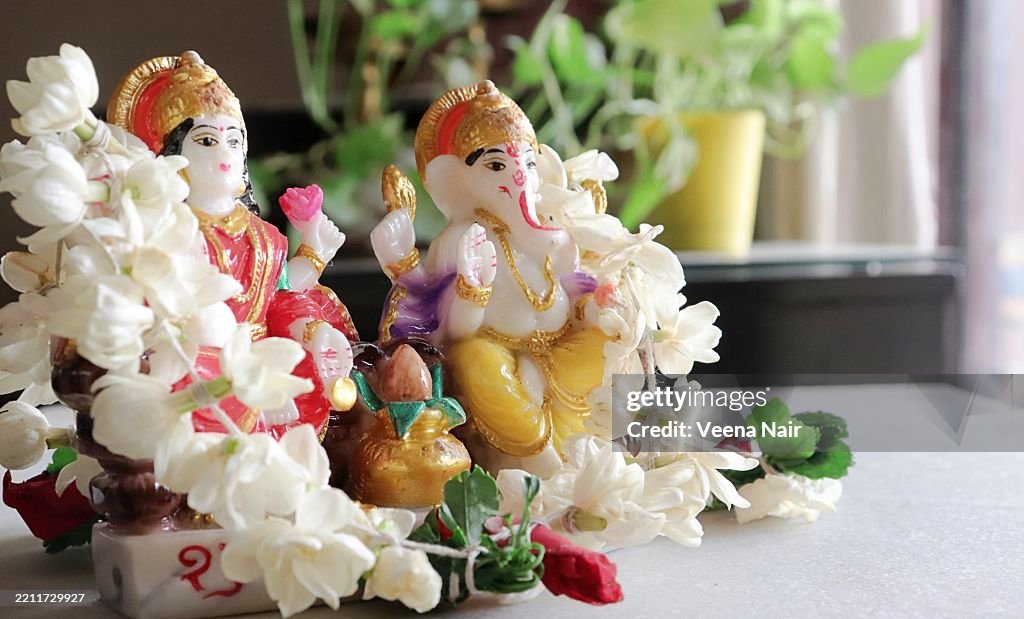 Goddess Lakshmi Ganesha figurine/idol/Kalash pot adorned with jasmine, mogra garland /Diwali/Deepavali /Dhanteras festival