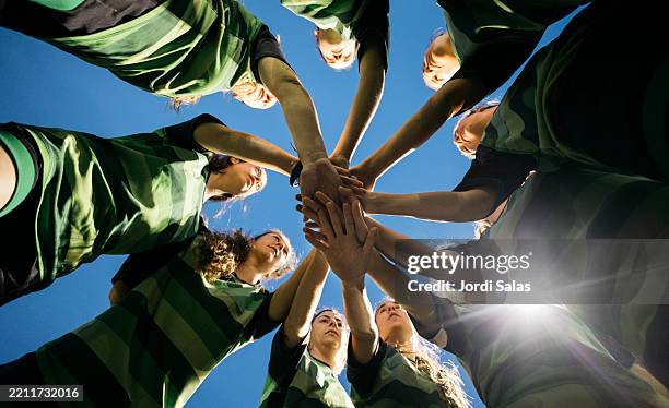 team unity with hands joined in a circle - rugby sport stock pictures, royalty-free photos & images