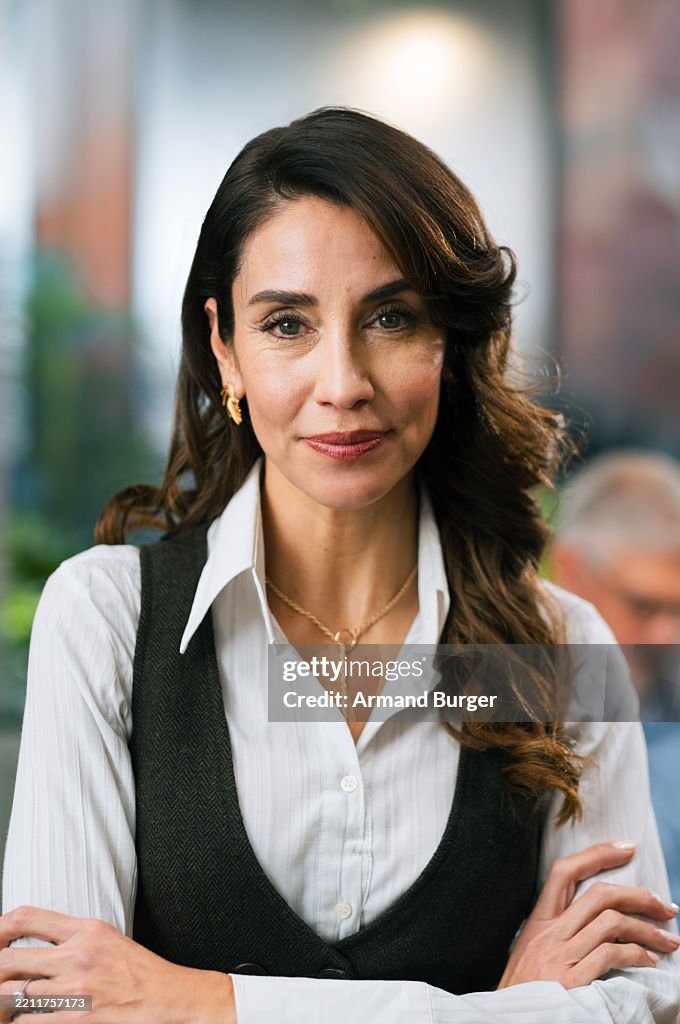 Portrait, ambitious and woman with arms crossed, corporate or lawyer with positive mindset for law firm. Business, attorney and mature person with pride for career growth, happy or employee
