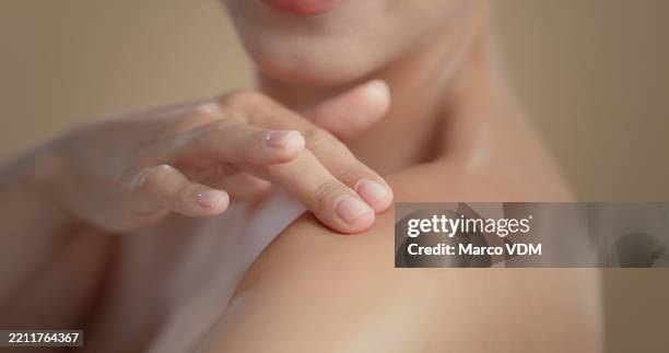 studio, woman and wellness with shoulder for skincare, collagen treatment and satisfaction with touch. isolated background, female person and closeup with results for cosmetics, smooth or dermatology - pele imagens e fotografias de stock