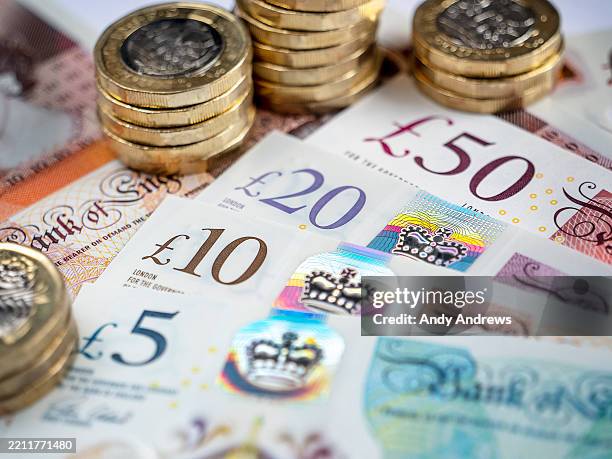 british pound notes and coins - british pound note stock pictures, royalty-free photos & images