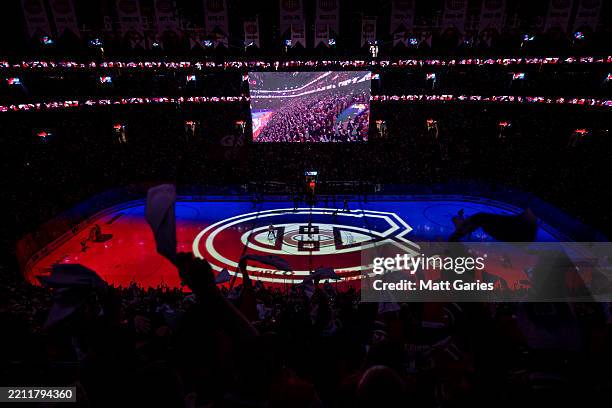 Canadiens logo is projected on ice in the opening ceremony of the Game Four of the First Round of the 2025 NHL Stanley Cup Playoffs between the...