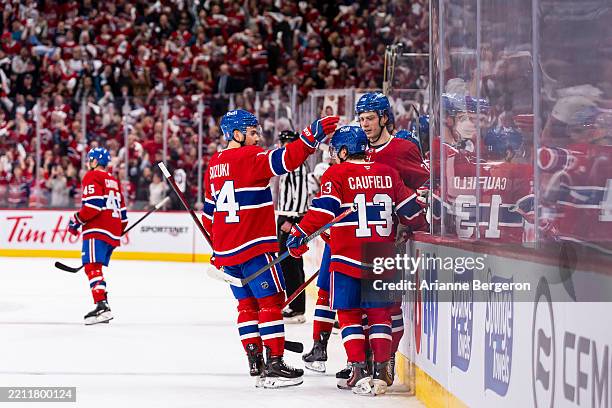 Cole Caufield of the Montreal Canadiens celebrates after scoring a goal during the second period of the Game Four of the First Round of the 2025 NHL...