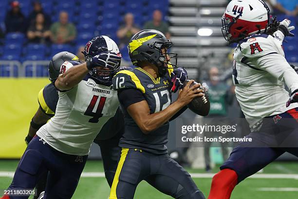 Houston Roughnecks outside linebacker Tashawn Bower gets his arms around San Antonio Brahmas quarterback Kellen Mond during the UFL football game...