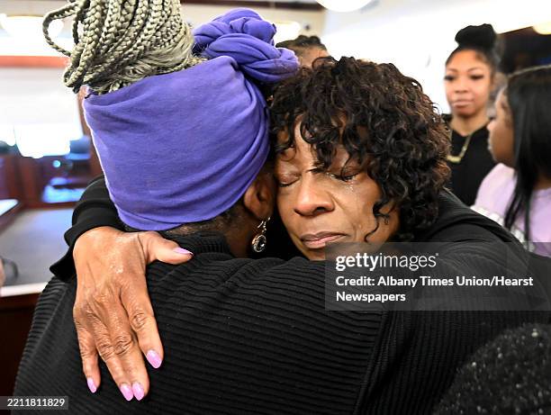 Sherrod Craft’s mother Arlene Brathwaite, right, gets an embrace from her good friend Niroma Johnson after a hearing at the Albany County Judicial...