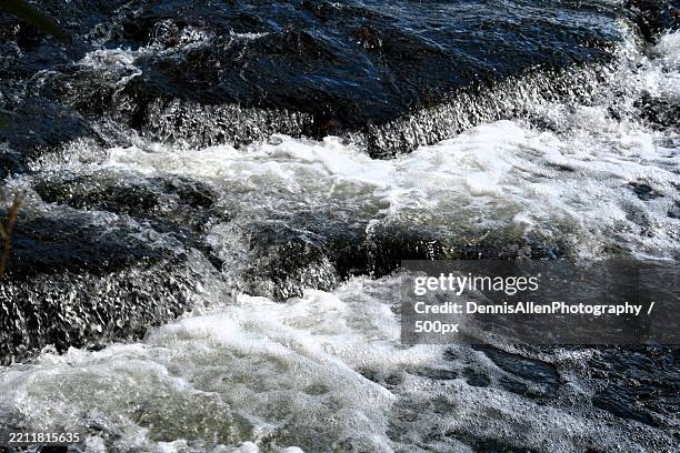 high angle view of waves splashing on rocks,peninsula,ohio,united states,usa - dennis oh stock pictures, royalty-free photos & images