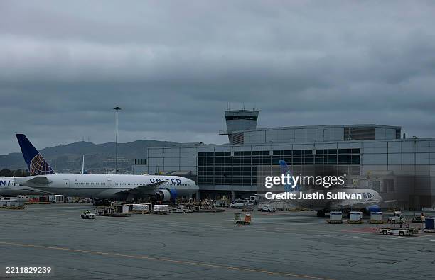 United Airlines planes sit parked at the ga at San Francisco International Airport on April 24, 2025 in San Francisco, California. Southwest and...