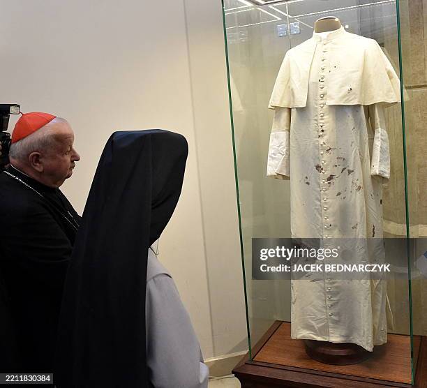 Cardinal Stanislaw Dziwisz with nun Tobiana, who took care of the pope, look on Pope John Paul II bloodied cassock at the Saint John Paul II...