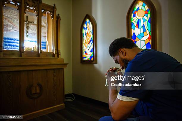 nurse alone in hospital chapel - chapel stock pictures, royalty-free photos & images