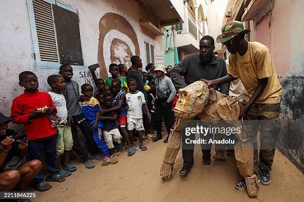 The Herds make a street performance with local artists in Medina, one of Dakar's iconic and most crowded neighborhoods, Senegal on April 27, 2025....
