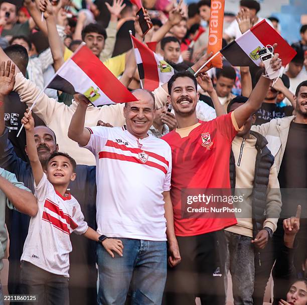 Fan wears a Zamalek T-shirt and another fan wears an Al-Ahly T-shirt at the U-20 Africa Cup of Nations in Cairo, Egypt, on April 27, 2025 .