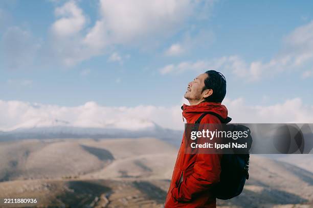 man relaxing on top of mountain in italy, abruzzo - inhaling stock pictures, royalty-free photos & images