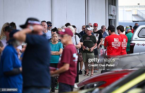 People queue to vote at an early voting centre on April 23, 2025 in the suburb of Strathpine in Brisbane, Australia. Nestled in the outer...