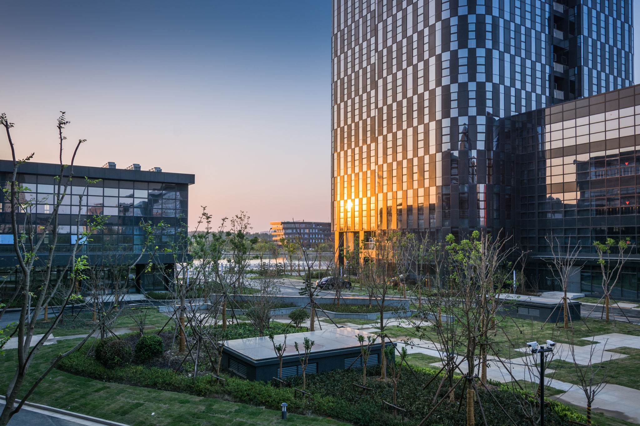 Stunning Urban Sunset Reflection in Modern Architecture with Green Spaces Stunning Urban Sunset Reflection in Modern Architecture with Green Spaces