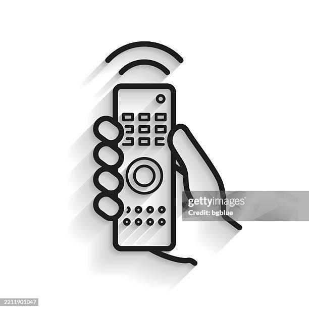 hand with remote control. line icon with long shadow on white background - holding remote control stock illustrations