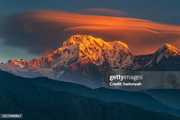 sunrise over mount annapurna range, himalayas, nepal - himalayas stock pictures, royalty-free photos & images