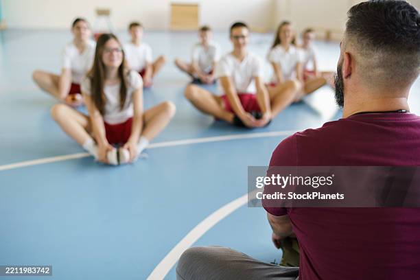 coach on training class whit teenage children - physical education stock pictures, royalty-free photos & images