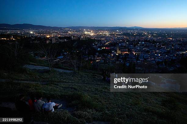 General view of the city of Granada, with the Alhambra, is plunged into darkness during the power outage that affects Spain nationwide in Granada,...