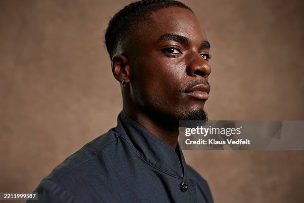 confident young man looking at camera - attitude stock pictures, royalty-free photos & images