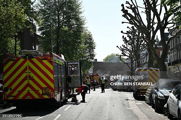 London Fire Brigade fire engines are pictured at the site of a fire at an electricity substation in the Maida Vale suburb of west London on April 29,...