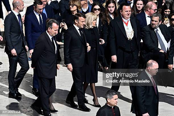 France's President Emmanuel Macron and France's First Lady Brigitte Macron arrive at the funeral of Pope Francis in St. Peter’s Square on April 26,...
