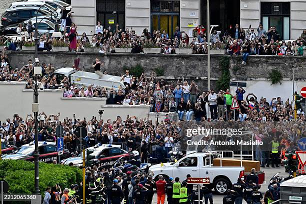 People gather along the road as the coffin of late Pope Francis is transported from St Peter's Basilica to Santa Maria Maggiore Basilica during the...