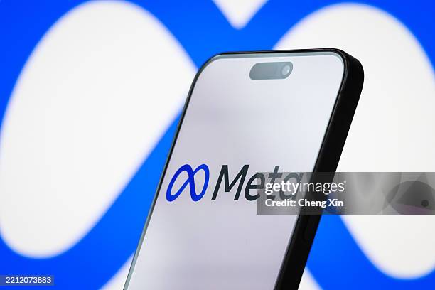 In this photo illustration, the logo of Meta Platforms, Inc. Is displayed on a smartphone screen, with the company's infinity loop-style branding...