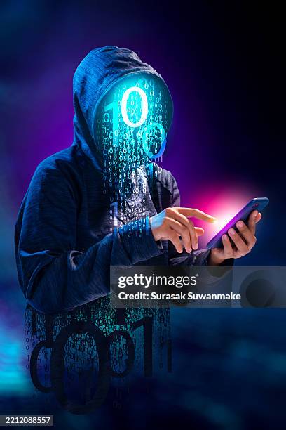 faceless hackers and malware hackers use laptops with dangerous digital code on binary code background. - stealing ideas stock pictures, royalty-free photos & images