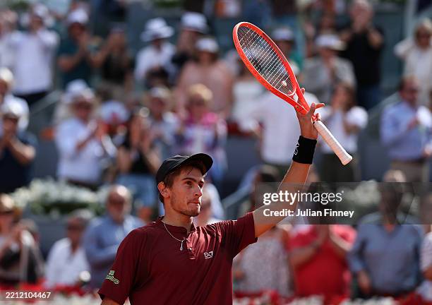 Matteo Arnaldi of Italy celebrates winning match point against Novak Djokovic of Serbia in the Men's Singles Second Round match during Day Five of...